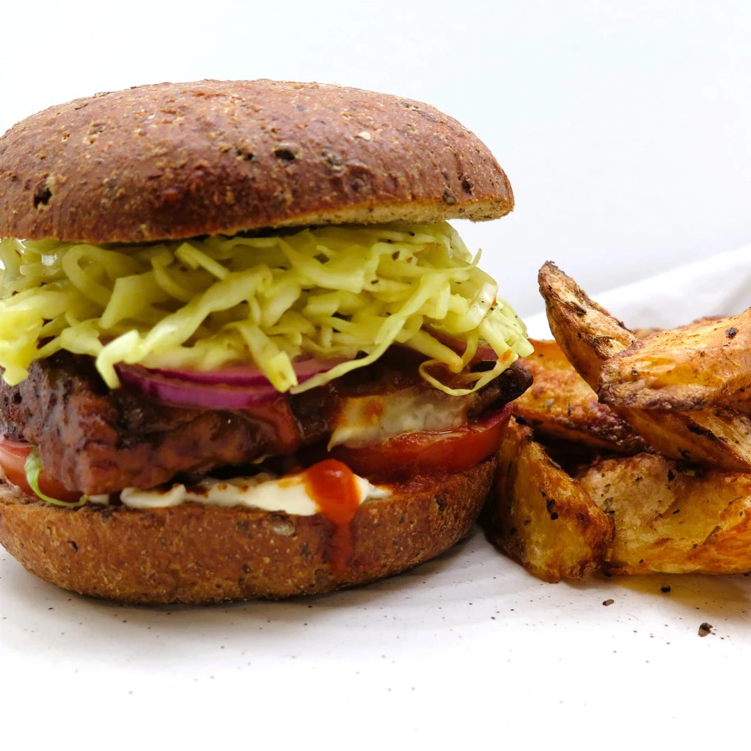 Tempeh burgers with slaw and hot sauce