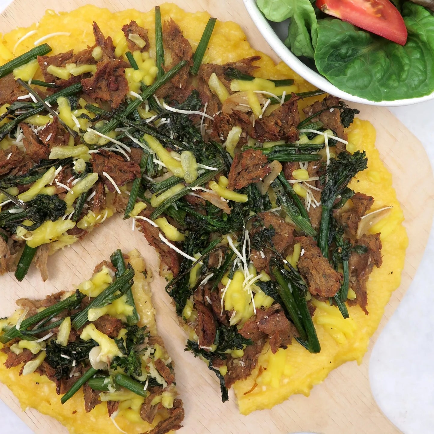 Sausage and broccolini polenta pizza